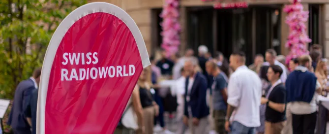 Radio Night Swiss Radioworld logo in the foreground, party in the background