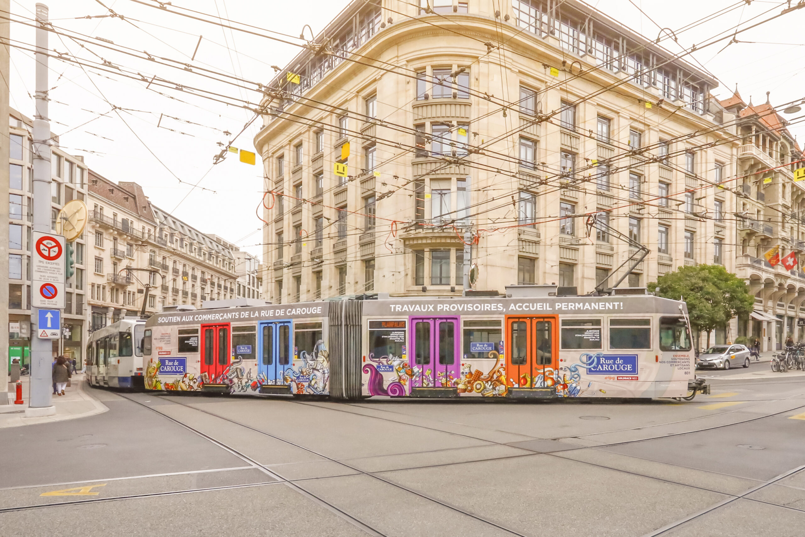 "Rue de CAROUGE" advertising on a TPG tram in Geneva
