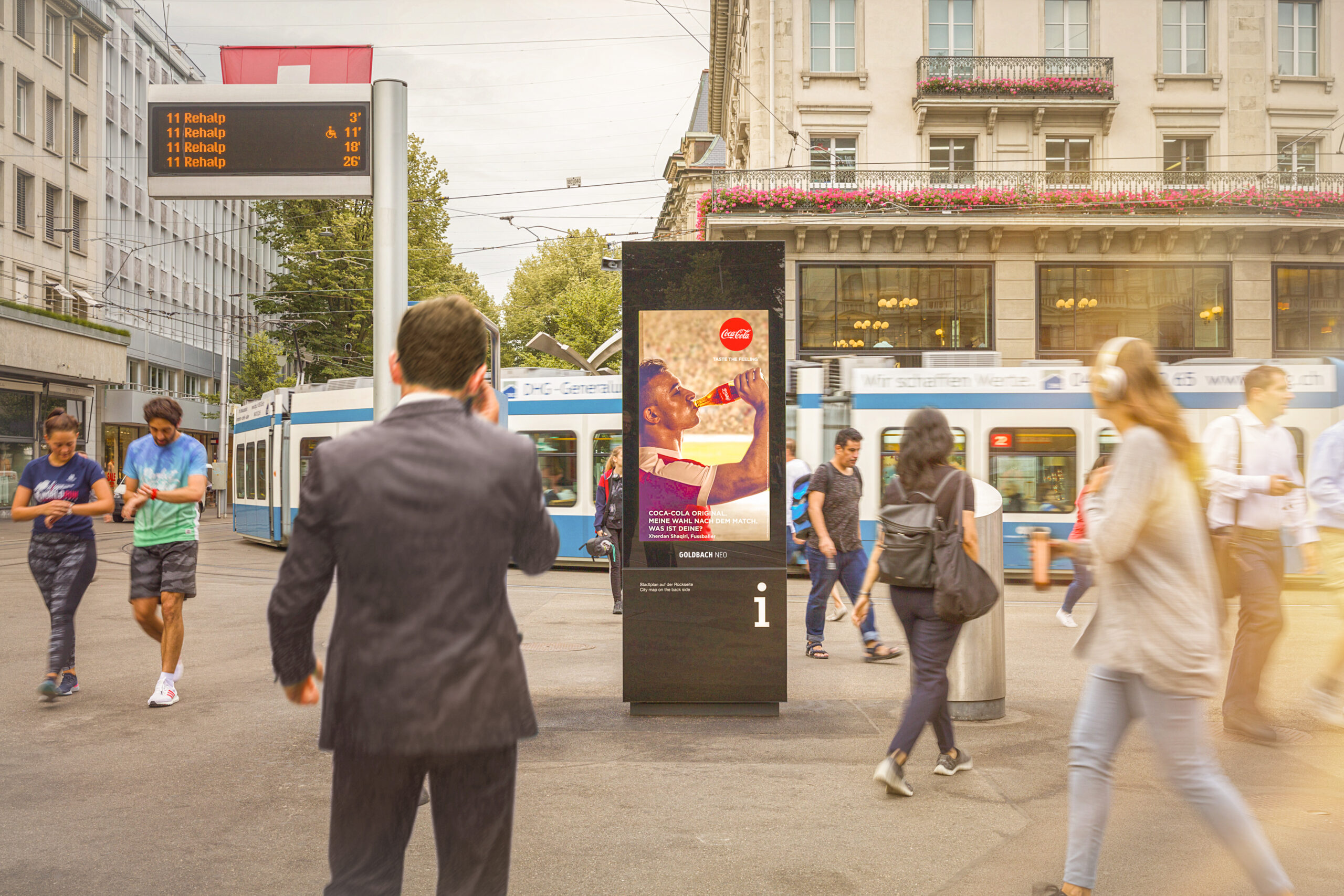 An eCity panel at Paradeplatz with people passing by.