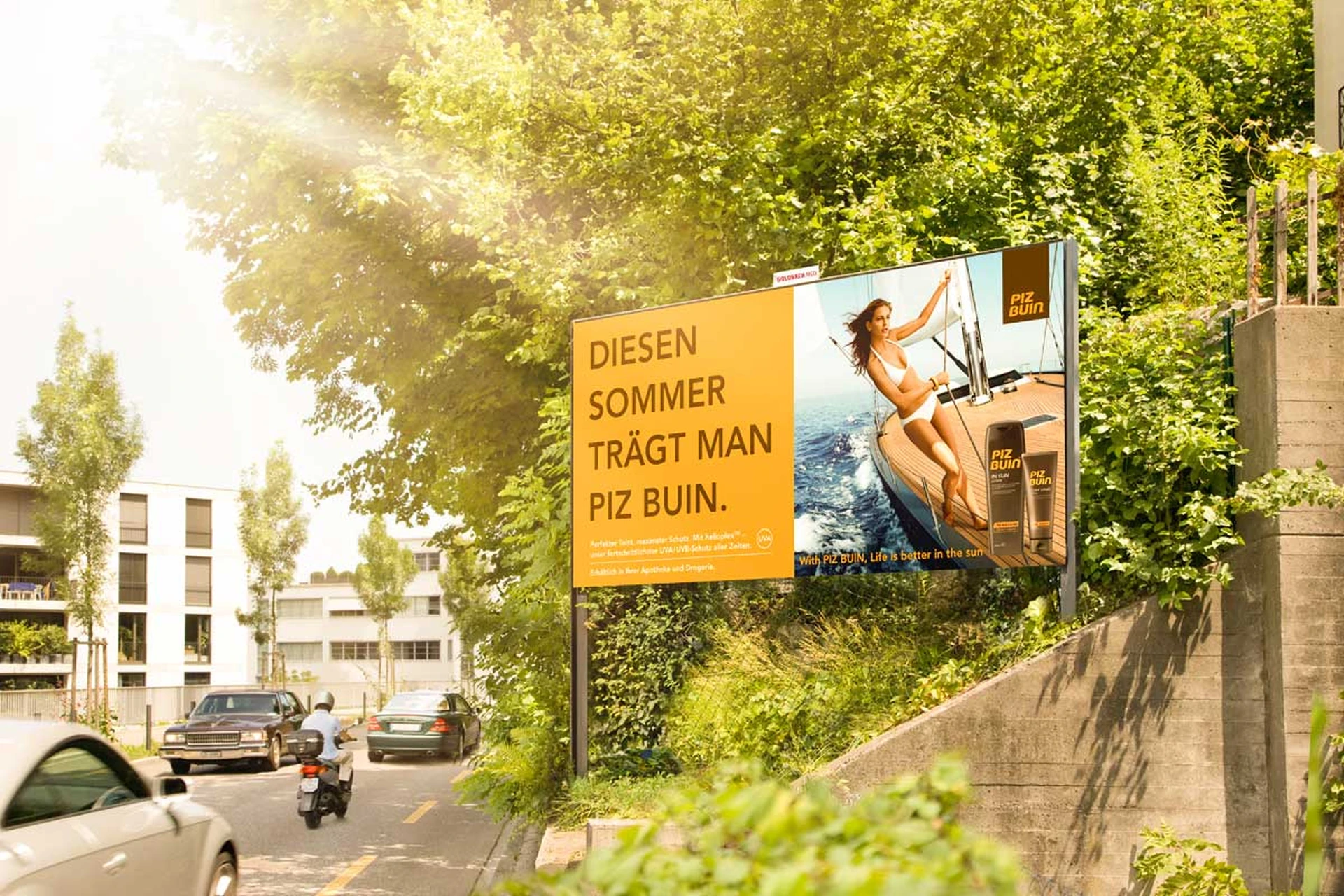 Poster site on Brandschenkenstrasse in a green setting.