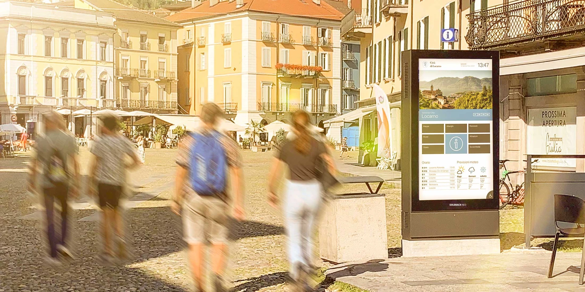 Screen on the street with people walking by