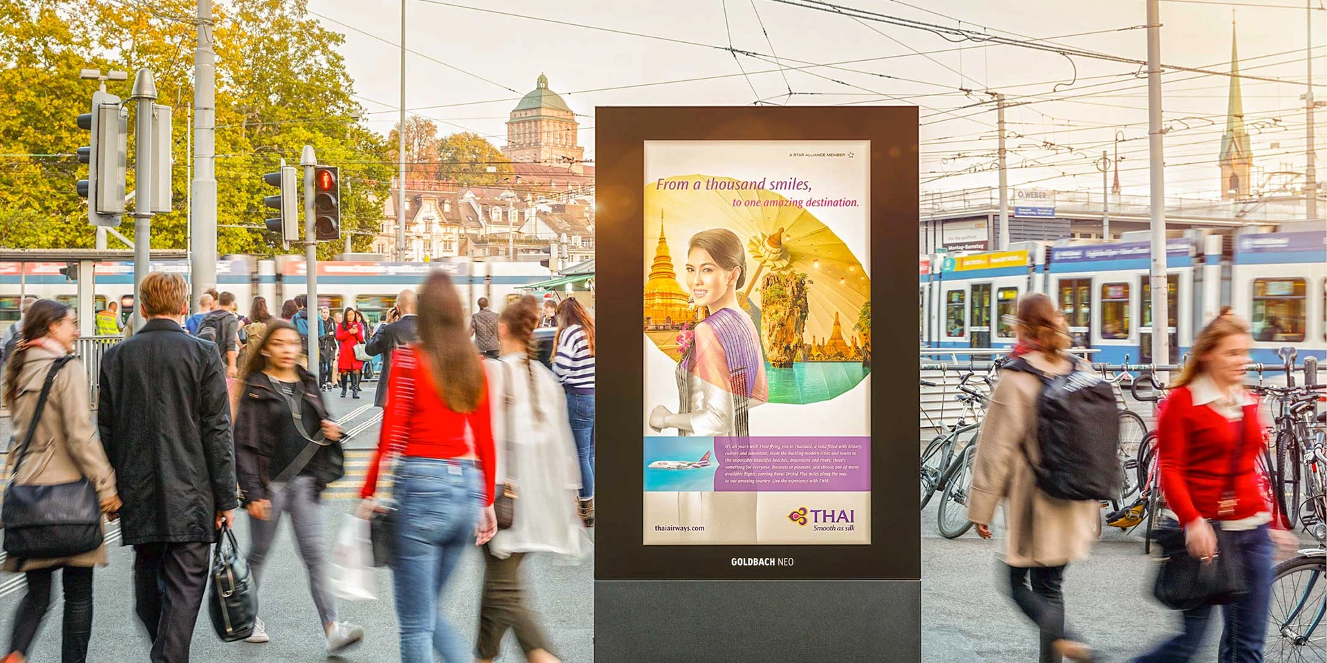 Beautifully designed poster on Limmatquai in Zurich with many people in motion.