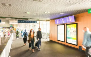 Advertising space with passersby with luggage