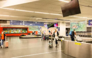 Advertising space with passersby with luggage