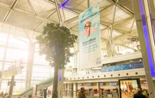 Advertising space with passersby with luggage
