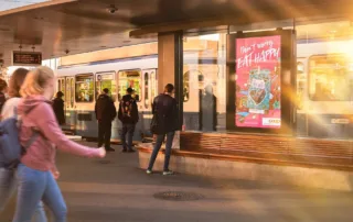 Advertising space at a tram stop and waiting people